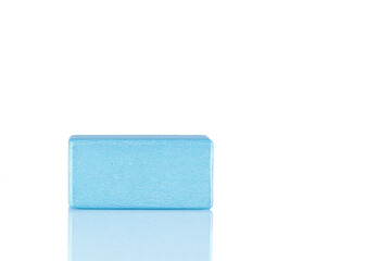 Wooden cube of blue color on a white background