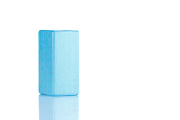 Wooden cube of blue color on a white background