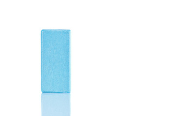 Wooden cube of blue color on a white background