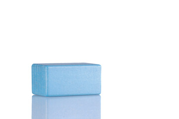 Wooden cube of blue color on a white background