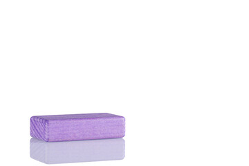 Wooden cube of purple color on a white background