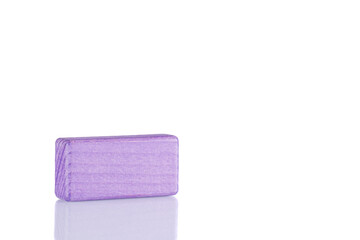 Wooden cube of purple color on a white background