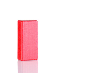 Wooden cube of red color on a white background
