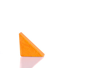 Wooden triangle orange colors on a white background