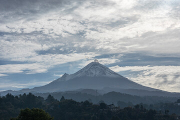 Popocatepetl volcano seen in the morning from a town in the state of Mexico, sunrise in the province