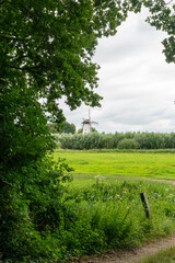 Windmill Molen De Vlinder (butterfly) along the river Linge as seen from Landgoed Heerlijkheid Mariënwaerdt in The Netherlands