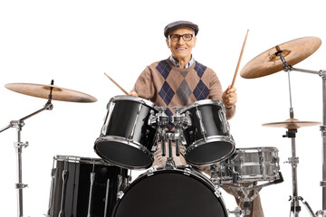 Elderly man playing on a drum kit