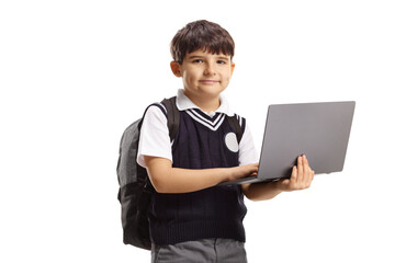 Boy in a school uniform holding a laptop computer