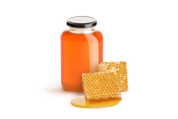 Jar of honey and pieces of honeycomb