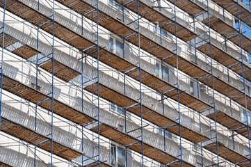 scaffolding on the facade of a house under construction