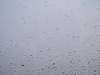 Raindrops on the window glass. Current raindrops.