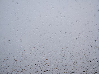 Raindrops on the window glass. Current raindrops.