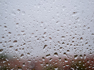 Raindrops on the window glass. Current raindrops.