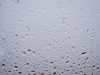 Raindrops on the window glass. Current raindrops.