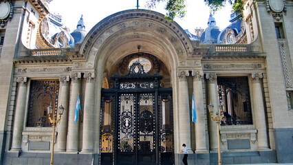 Argentinian flags flying around the main door of the San Martin Palace in Buenos Aires, Argentina
