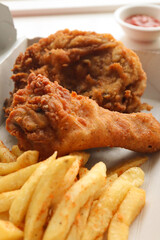 Fried chicken. Deep fried chicken with chips and tomato sauce 