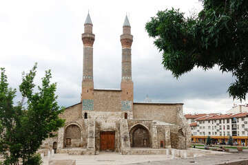 Fototapeta na wymiar Twin minarets madrasah in Sivas city - Sivas is a tourist magnet city of modern Turkey with many historical monumental remains. 