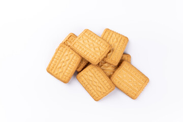 pile of sweet wheat flour cookies on a white background