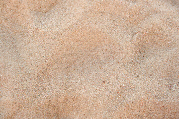Fototapeta na wymiar Flat view of clean yellow sand surface covering seaside beach. Sandy texture
