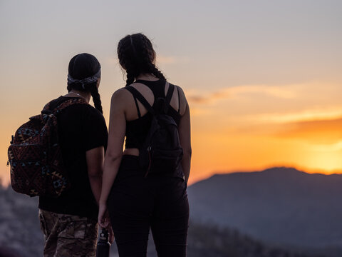 Horizontal image of Indigenous youth enjoying sunset