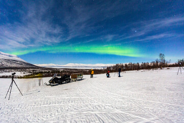 Aurora borealis at Abisko in Sweden. a night with colors in the sky. cold, snow and lights a beautiful landscape