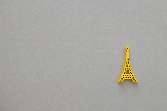 Colored wooden Eiffel Tower on grey background