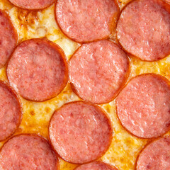 Obraz premium Pepperoni pizza with salami and cheese on a white background