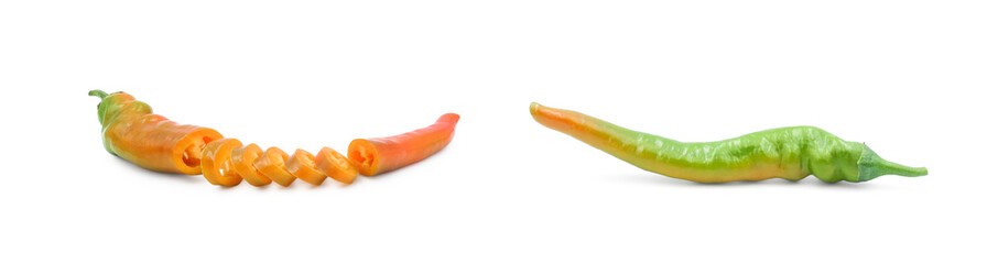 Sliced red hot chili pepper and whole green one isolated on white background side view. Seasoning for cooking. 