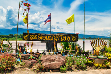 Nagas (mythical serpents), flags and decorations on the premises of Buddhist temple Wat Along...