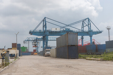 Fototapeta na wymiar Container loading in a Cargo freight ship with industrial crane. Container ship in import and export business logistic company. Industry and Transportation concept.