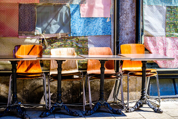 table and chairs at a sidewalk cafe