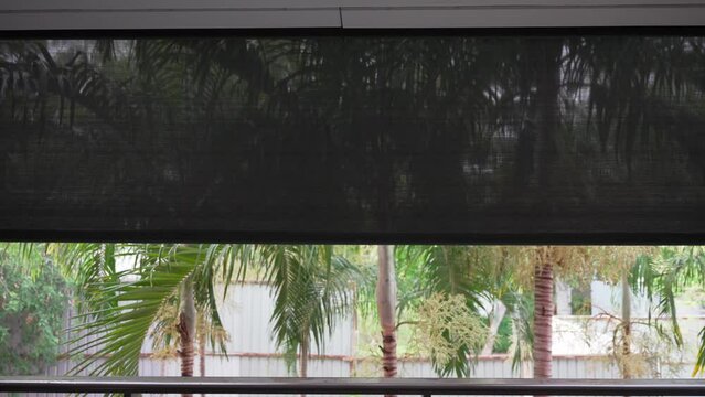 Automatic dark blinds moving down closing for privacy in the hotel