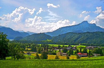 alpine green flatland aka downcountry and mountain line in sunny day with white clouds, travel diversity