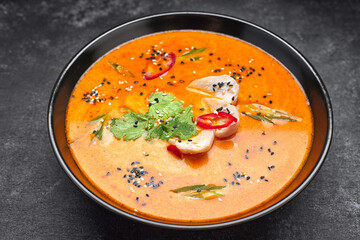 Thai soup in a plate with chicken