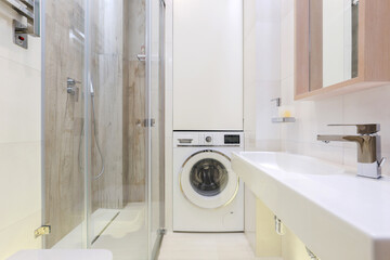 Washing machine in a modern bathroom interior