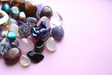 Semi-precious stones of different colors. Amethyst and amethyst druse crystals, rose quartz, agate,...
