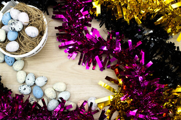 black and golden Tinsel and pink with easter eggs. holidays concept