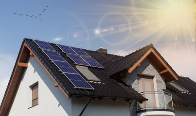 Solar panel home photo of house. Photovoltaic on modern home. Solar panel architecture and sun ray.