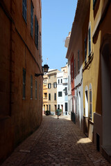 Fototapeta na wymiar Ciutadella, Menorca (Minorca), Spain. Beautiful, narrow streets of Ciutadella.