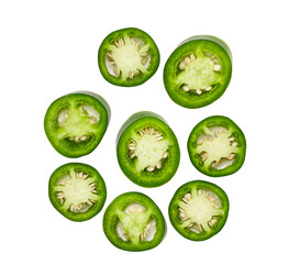 Fresh green cut chili pepper pieces isolated on white background top view.