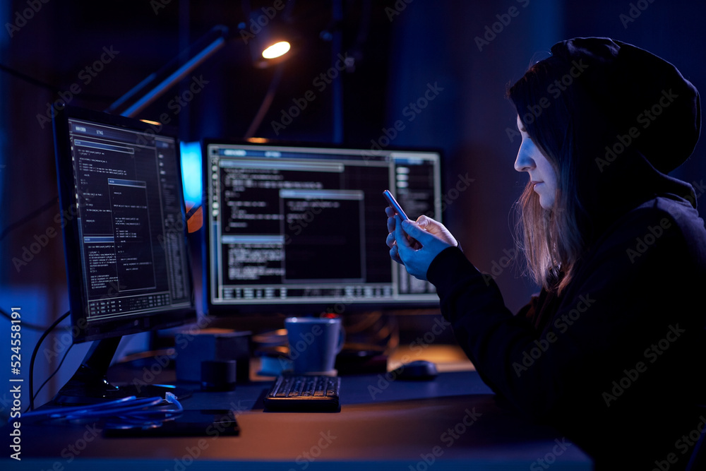 Poster cybercrime, hacking and technology concept - female hacker with smartphone using computer virus prog