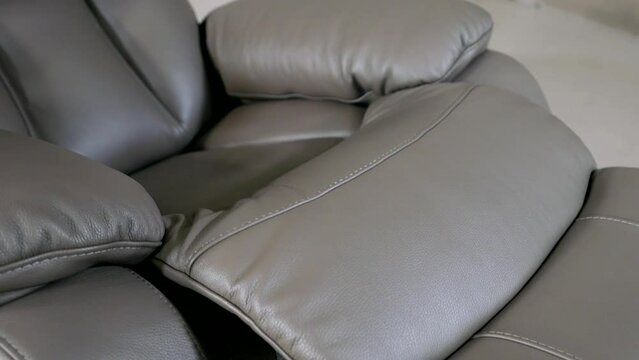 comfortable and cozy leather recliner chair for rest and relax in home, demonstrating sample in showroom
