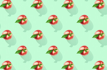 Pattern of peaches on green pastel background