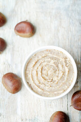 Fresh homemade chestnut paste on a wood background