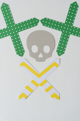 paper skull with paper crosses