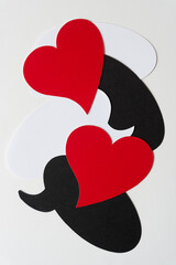 grungy red hearts and black and white speech bubbles