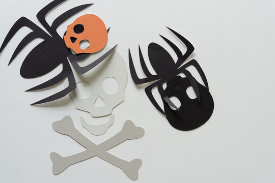 creepy paper spiders with skulls and bones
