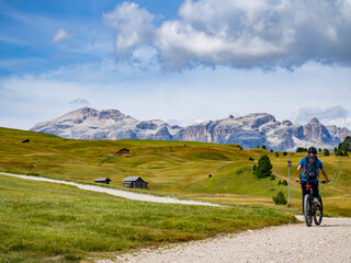 Cycling scene on the dolomites - 524565310