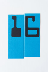 MICR font numbers 1 and 6 on blue paper strips and blank paper