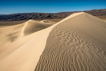 Rippling Texture of Panamint Dunes and Darwin Plateau In The Distance